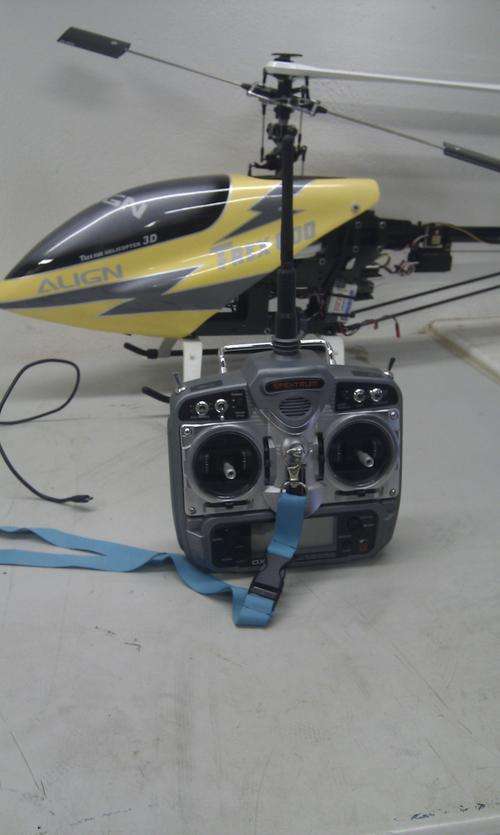 All-in-one auction for a New TREX 600 ESP helicopter, spektrum DX7 mode 2 transmitter and more