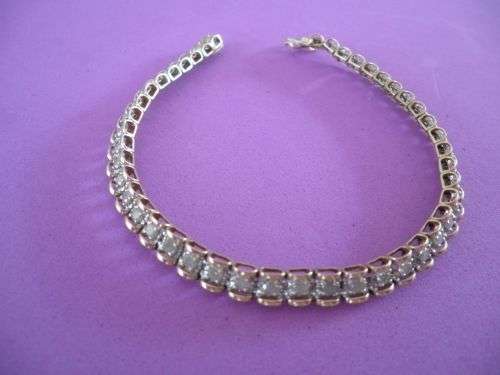 Yellow gold and diamond tennis bracelet